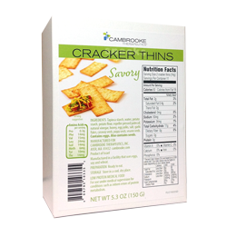 150 gram white and green box of Cambrooke Savory Cracker Thins.