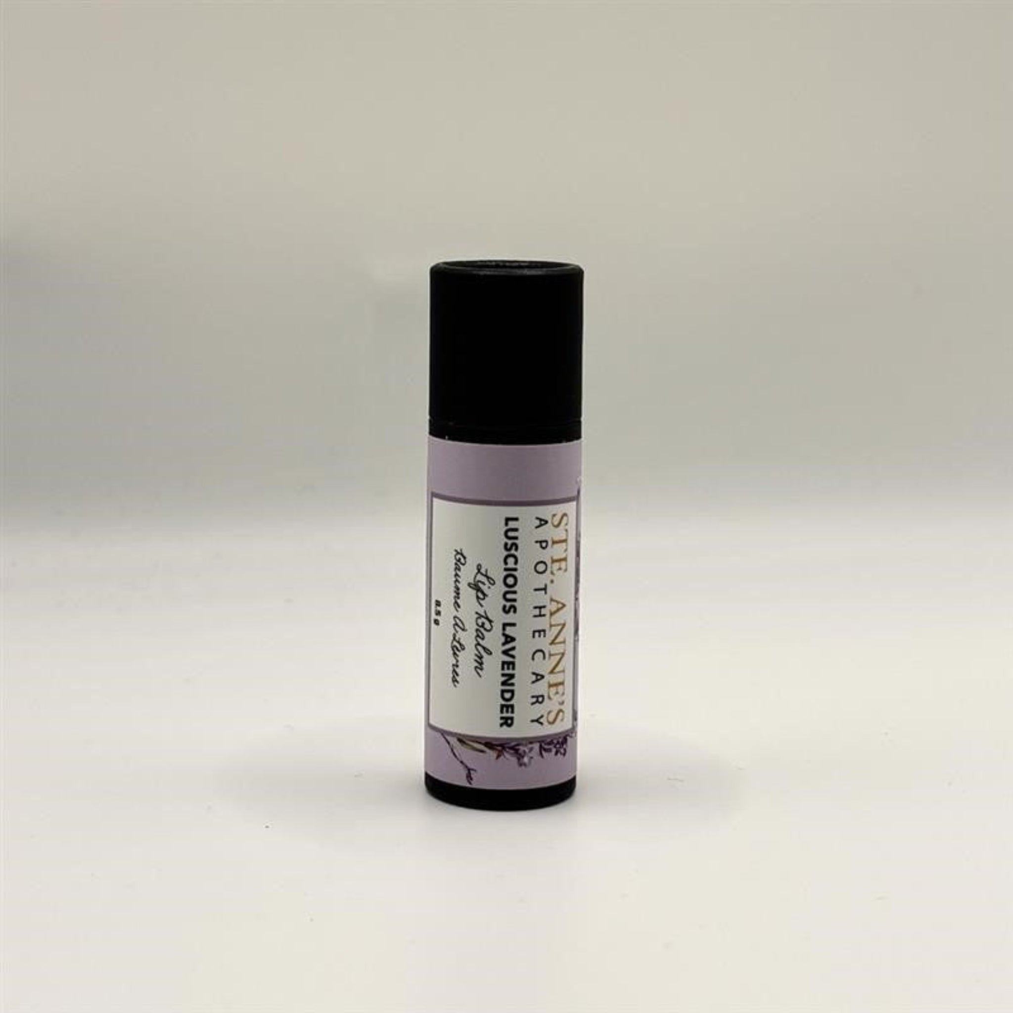 Ste Anne's Luscious Lavender Lip Balm, purple tube with black cap. 