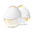 Two white Medela Motion InBra breast pumps with yellow accents on a white background.