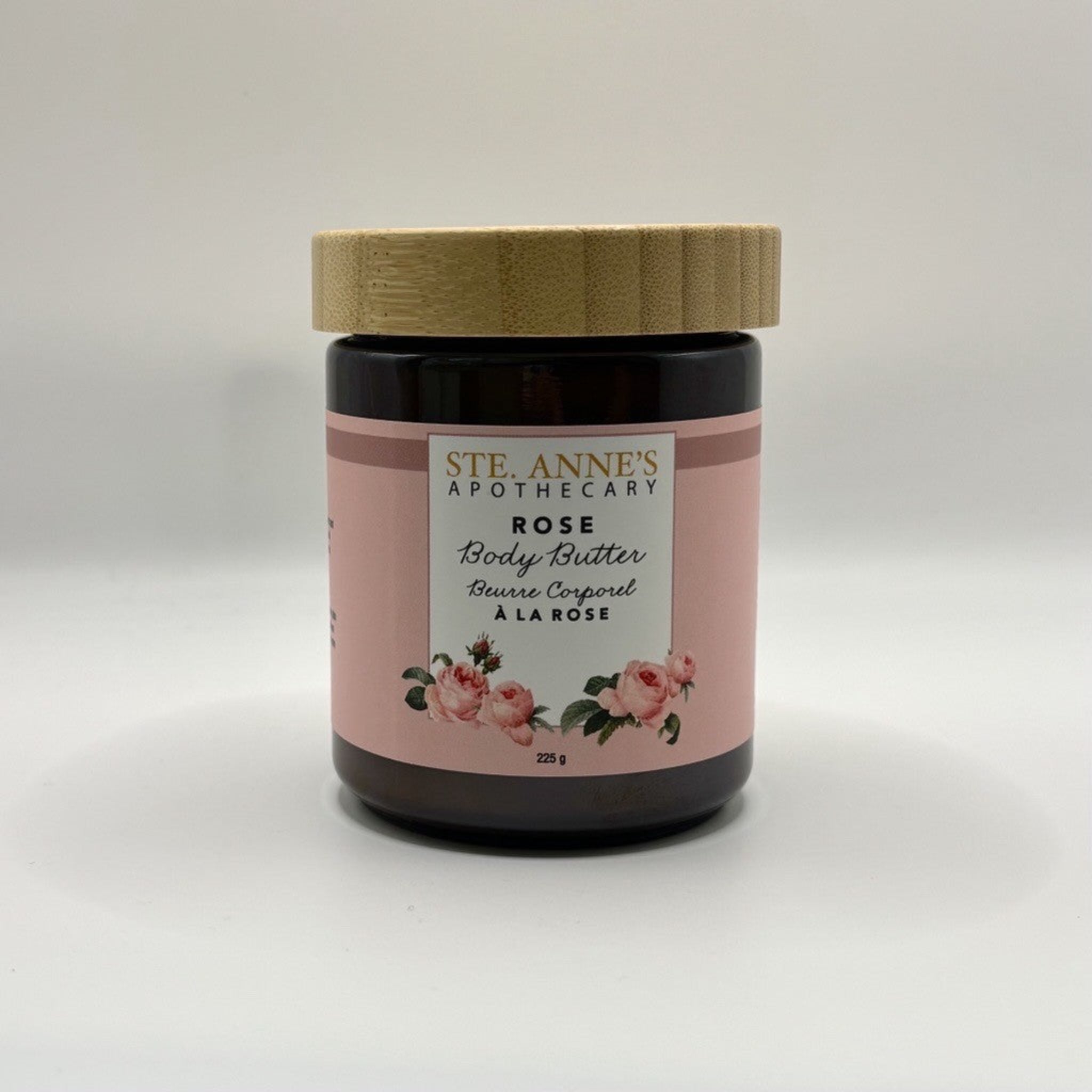 Ste Anne's Rose body butter in a glass jar with a wood lid. 225 grams. 