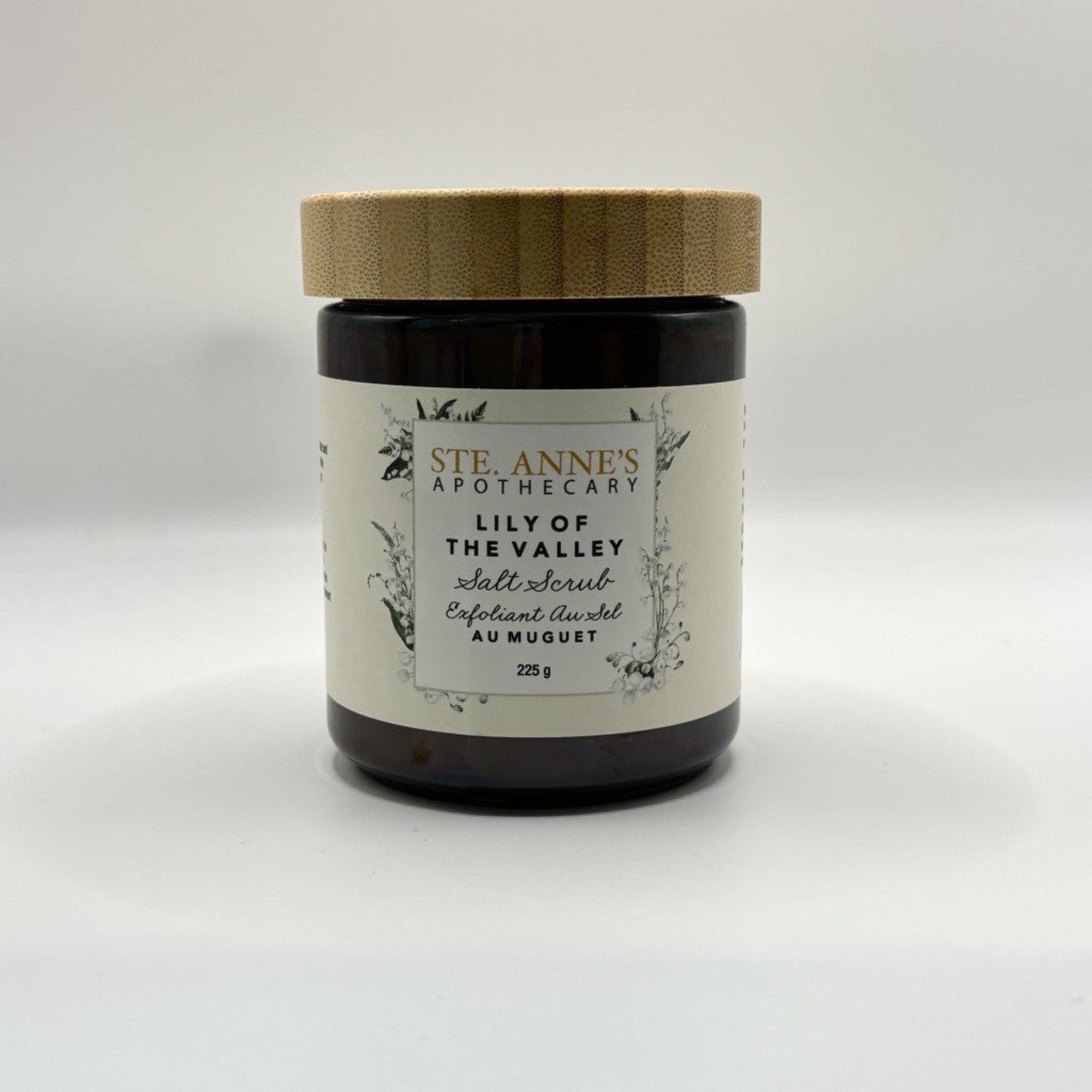 Ste Anne's Lily of the Valley Salt Scrub in glass jar with wood lid. 225 grams.